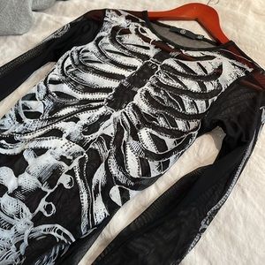 Sexy skeleton bodysuit with rhinestone appliqué.  Sheer back.